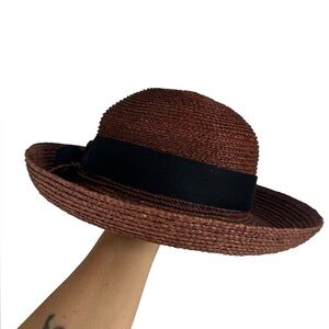 Helen Kaminski brown straw raffia hat with black bow in perfect condition.